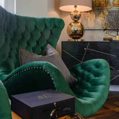 DEMI green curved chair with button-tufting, velvet upholstery, and black base for luxurious comfort and elegant design.