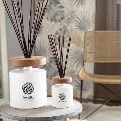 Papua Reed Diffuser – matte-white luxury diffuser with apple, mint, cocoa, and moss notes from Jambo Prestigio Collection.