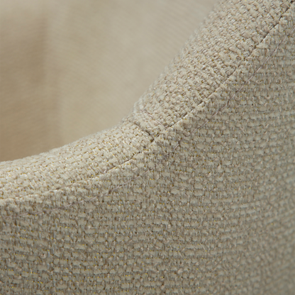 OLA dining chair in frosted almond boucle with curved arms and antique brass legs by AK Interior Living

