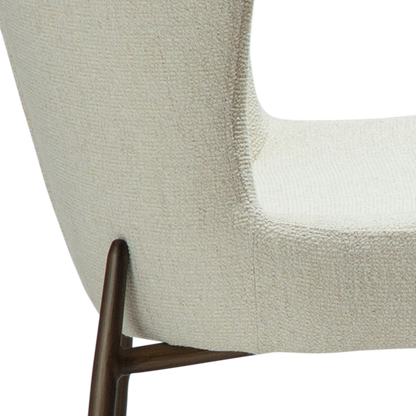 ELSA dining chair in bone white bouclé with curved back and antique brass legs by AK Interior Living