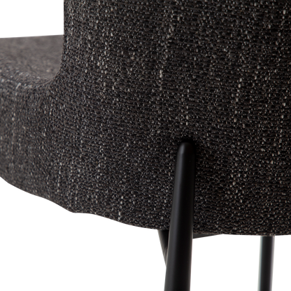 MORGAN raven black bouclé dining chair with black extended legs and softly curved seat by AK Interior Living