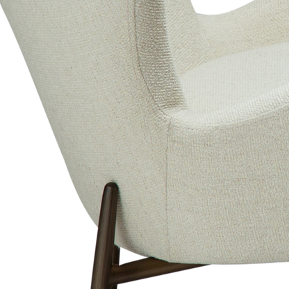 CARL bone white bouclé lounge chair with sculpted backrest and antique brass legs from AK Interior Living