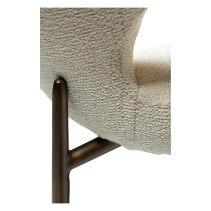 LELA bouclé dining chair with curved back and antique brass legs from AK Interior Living