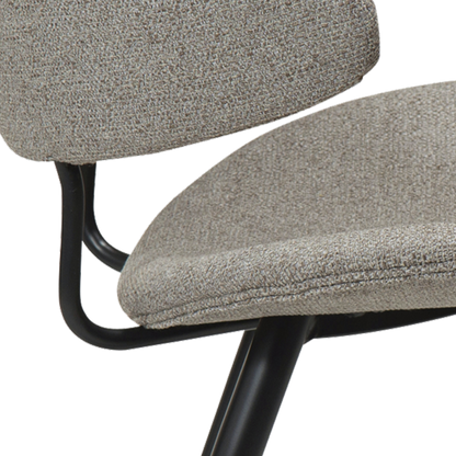 SELA boucle fabric dining chair with pointed backrest and black legs from AK Interior Living