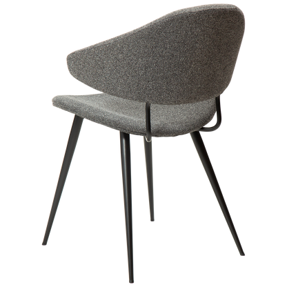 SELA boucle fabric dining chair with pointed backrest and black legs from AK Interior Living