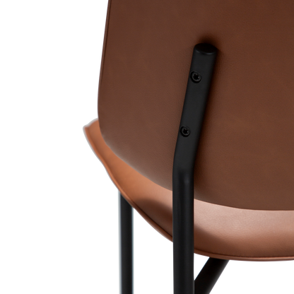 UMA leather dining chair with curved seat and black legs from AK Interior Living