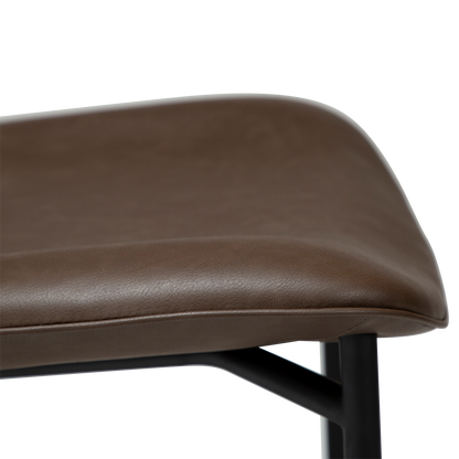 UMA leather dining chair with curved seat and black legs from AK Interior Living